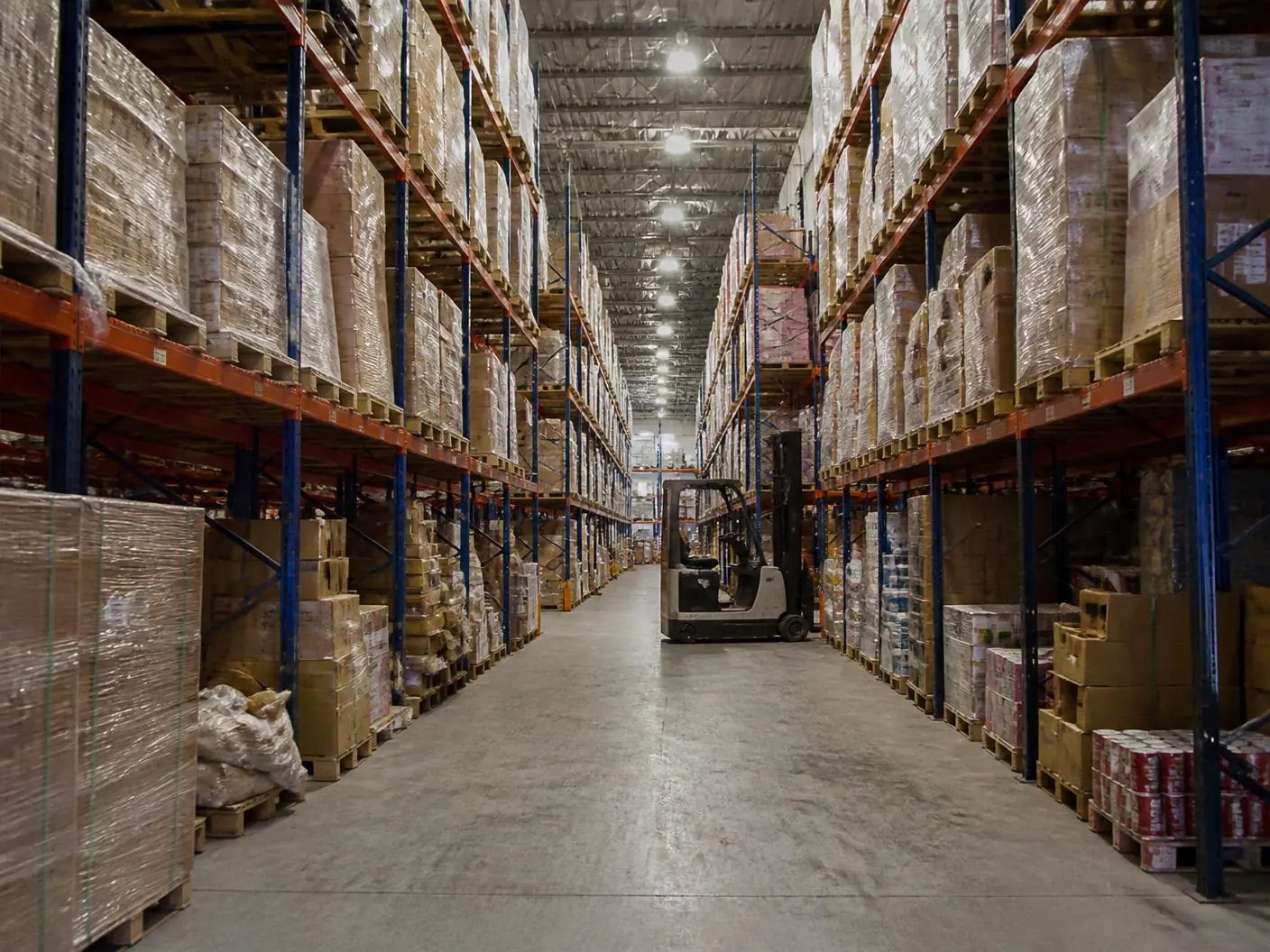 Inside the PalletCove Liquidation warehouse in Houston, Texas with pallets staged for resellers